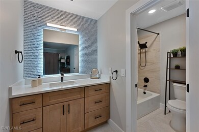 Full bath with visible vents, toilet, tile pattern