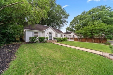 Ranch-style house featuring brick siding