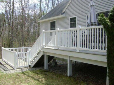 Exterior Back. Fenced upper deck...