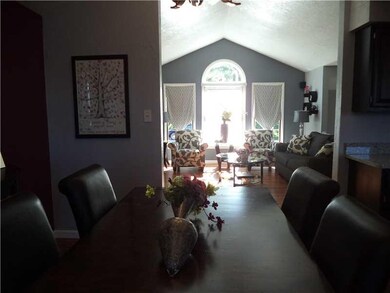 Living Room. View of cathedral ceiling from dining