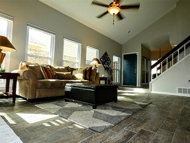 Tons of natural light. Living room with custom bli