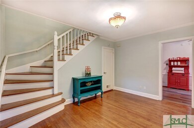 Formal entrance foyer with curved, all wooden stai