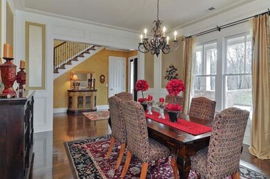 Large formal dining area with the decorate shadow boxes and crown molding.