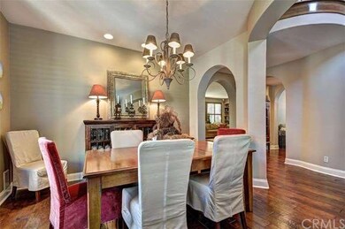The formal dining room surrounded by arches.