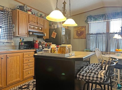 Kitchen with stainless steel fridge, a kitchen bre
