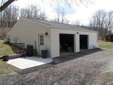 Other. Large detached garage has overhead heater, 