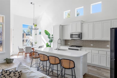 Kitchen featuring appliances with stainless steel