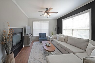 Living room featuring dark wood finished floors, c