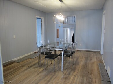 Dining area featuring a chandelier and hardwood / wood-style flooring