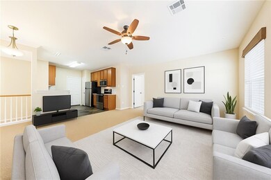 Living room featuring a ceiling fan, dark colored