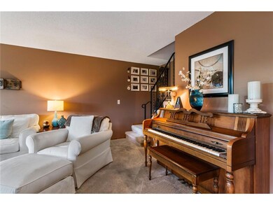Spacious living room with stairway leading to uppe