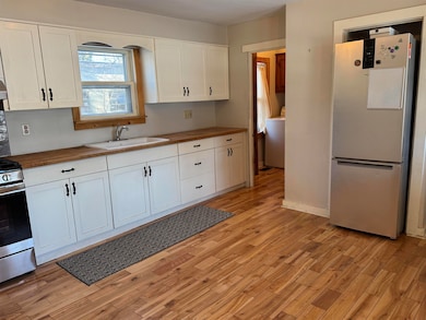 Separate room for laundry off kitchen
