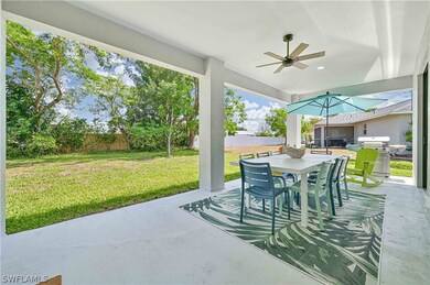 View of patio with ceiling fan and grilling area