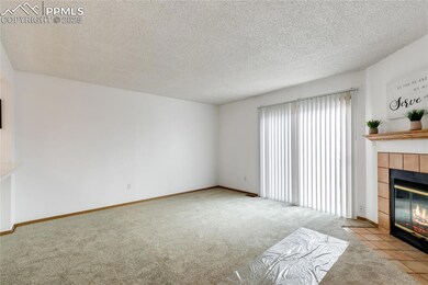 Unfurnished living room with light colored carpet,