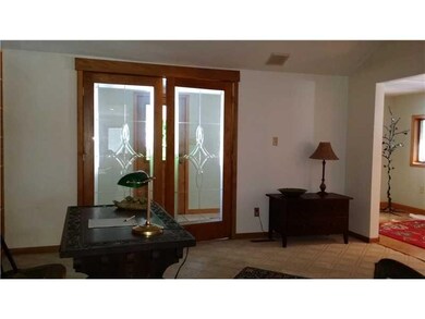 Dining Room. Dining room with wall of wood shelvin