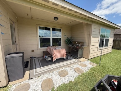 Has a covered back patio.  Great place to sit back