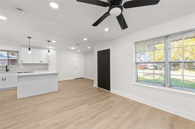 Living room/kitchen area of the home. Opened up fl