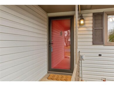 The covered front patio greets and shelters your g