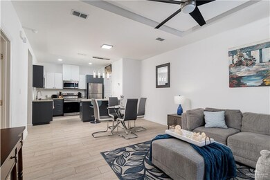 Living area with recessed lighting, ceiling fan, light wood finished floors, and visible vents
