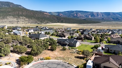 Aerial perspective of suburban area with a mountainous background