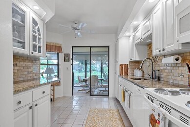 Kitchen has been updated with newer cabinets, coun