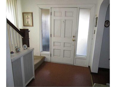Entry/Foyer. The Front Door, framed by Sidelights,