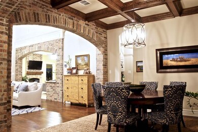 Open concept dining with wood detail ceiling and t