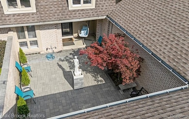 Spacious gated courtyard with brick pavers. . .