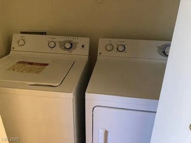 Laundry room with washing machine and dryer