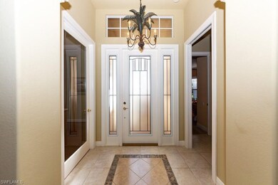 Foyer shines with interesting inlaid tile & there'