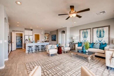 Living Room and Kitchen: *Photo is of a model home