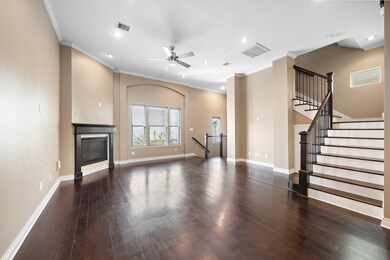 Spacious second-floor living area featuring an ope