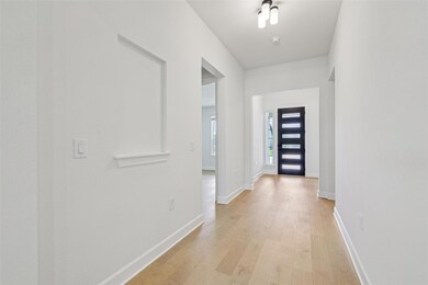 Foyer entrance featuring light wood-style floors 