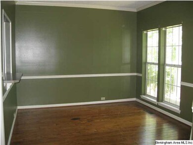 Dining room features crowm molding & chair rail, l