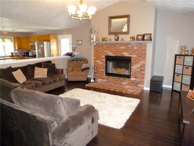 Large living room, tall ceiling, fire place, hardw