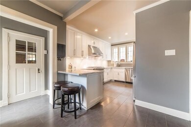 The light and bright kitchen give access to the at