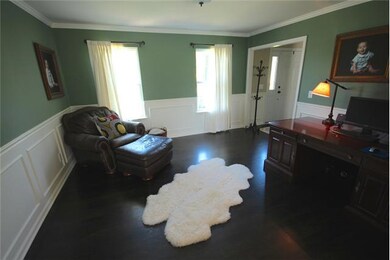 Formal Living Room or Home Office with Hardwood Flooring and Wainscoting