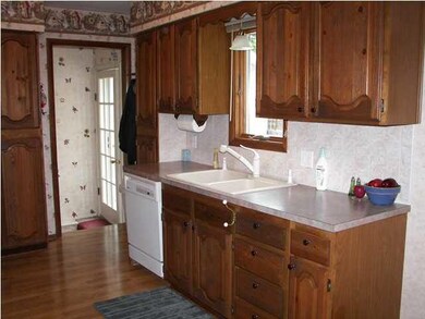 The kitchen sink has a window over it.