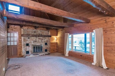 Beautiful wood beams in the living room with tall 