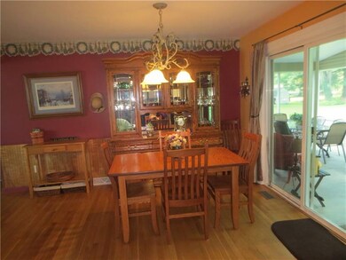 Dining room opens to oversized sunroom.