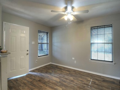 Foyer entrance with ceiling fan, dark hardwood / w