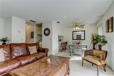 Open floor plan leads into kitchen with additional