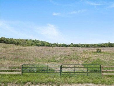 High grade wood fence along 900th Rd with single a
