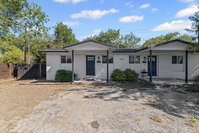 Single story home with brick siding