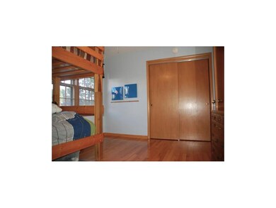 One of three spacious bedrooms with double wide cl