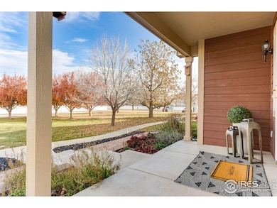 Spacious covered front porch looks out to landscaped HOA open space with easy guest parking to the north side.