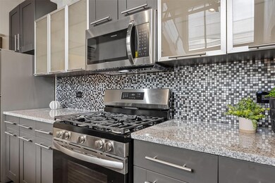Kitchen with stainless steel appliances, tasteful
