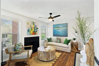 Living room with dark hardwood / wood-style floors