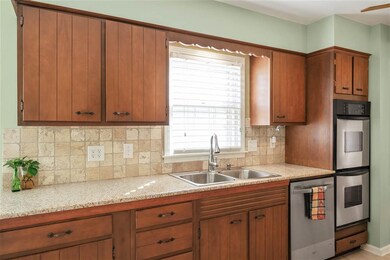 Granite Counters and Custom Tumbled Marble Backspl