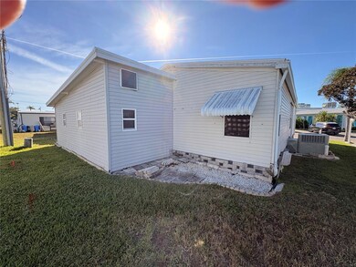 See the added on shed to the back of the home... great workshop!